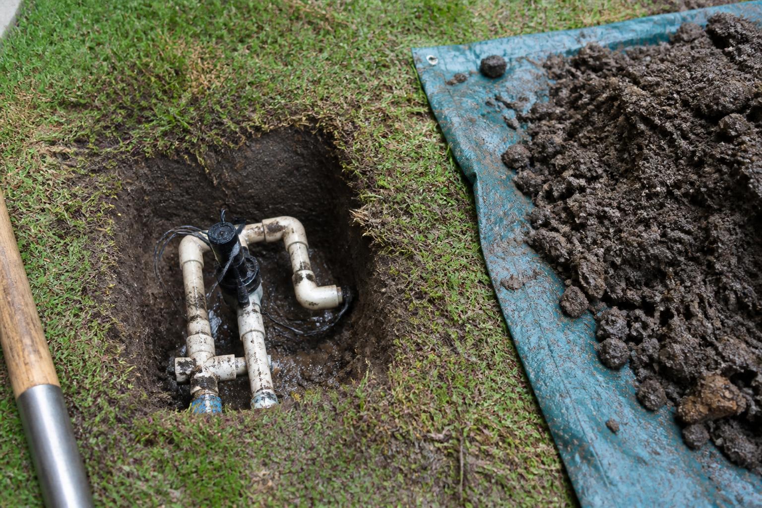 Sprinkler valve manifold repair in an open trench